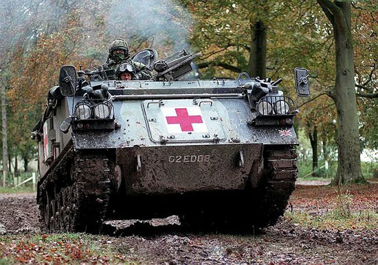 An AFV 432 ambulance speeds through part of Salisbury Plain Training Area during a demonstration in transporting the wounded back through the chain of evacuation. The demonstration was during Exercise Iron Amalgam which took place from 24-27 Oct 00. This was the first opportunity to deploy the medical regiments of 3 (UK) Division's Medical Group in its new configuration. The deliberately ambitious exercise involved officers and soldiers from 1 Close Support Medical Regiment, based in Germany, elements of 22 Field Hospital, 4 General Support Medical Regiment, Support Helicopter Force Benson and the Tactical Medical Wing of the Royal Air Force in addition to the Division's own medical units. 