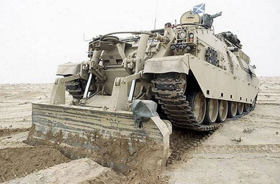 Gulf War Operation Desert Storm. A Challenger Armoured Repair and Recovery Vehicle (ARRV) uses its dozer blade to dig in. 