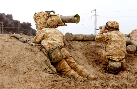 A Milan anti-tank section search for targets, near Basra. Iraq. 25/03/2003 Troops of the 1st Battalion, The Royal Regiment of Fusiliers, observing the front line just outside Basra with their Milan anti Tank weapon