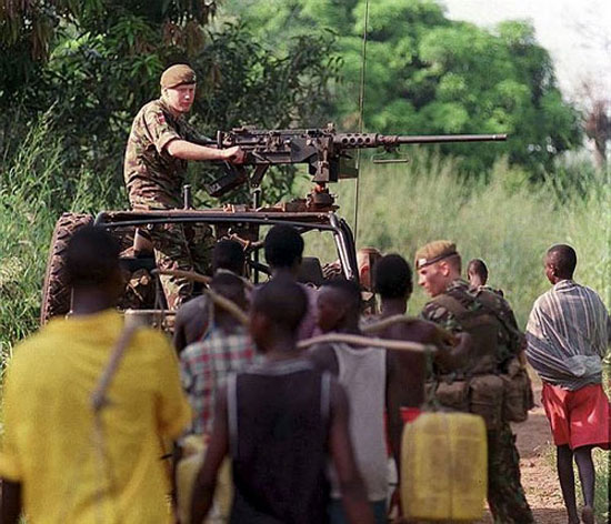 A soldier mans a L1A1 12.7mm heavy machine gun mounted on a Land Rover during a security patrol near the Sierra Leone Army Battle Camp at Newton, 45km SE of the Sierra Leone Capital Freetown. The 1st Battalion the Prince of Wales Own Regiment of Yorkshire spent 8 weeks in the former British Colony helping to retrain the Sierra Leone Army. 